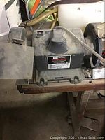 Side view of Sears Craftsman bench grinder showing motor housing and controls