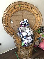 Full front view of wicker peacock chair with stuffed toys removed