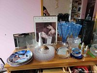 Overview of lot showing plates, vases, bowls, shell dish, salt & pepper shakers