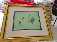 Full view of framed and matted serigraph cel showing two characters on green background