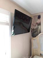 Front view of 46-inch Samsung TV mounted on wall