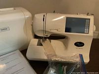Brother Pacesetter PC-8200 sewing machine with sample fabric and bagged accessories