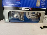 Photo of boxed Moen tub and shower valve and spout components in chrome finish