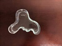 Top-down view showing organic freeform silhouette and smooth glass surface