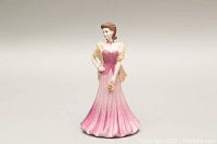 Front view of the Pauline figurine showing detailed gown and bouquet