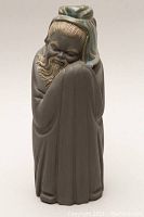 Front view of the Lladro Chinese holy man figurine showing detailed facial features and robe folds.
