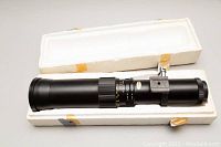 Soligor 450mm f/1.8 telephoto lens in original white styrofoam packaging box, showing lens body and packaging from above.