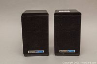 Pair of black KOSS M65 Plus stereo speakers front view