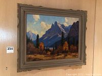 Framed painting hanging on wall