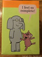 Close-up of Elephant and Piggie illustrated book cover with title 'I Feel So Complete!'