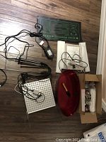 Overview of various indoor planting supplies including electronic grow mats, LED light panel, tools, basin, and accessories.