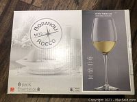 Closed box of Bormioli Rocco 8 pack Vino Regale wine glasses, showing product branding and glass image on front.