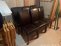 Six chairs arranged together showing overall set