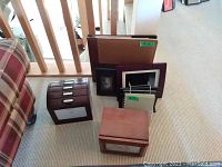 Overview of lot items including Eddie Bauer photo box, photo albums, and photo holder
