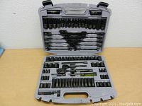 Full view of the organized Husky mechanics toolset inside gray plastic case showing sockets, wrenches, ratchets and accessories.