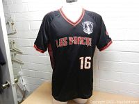 Front view of the black men's Arizona Diamondbacks Los DBacks jersey with number 16 and team logo on the chest.