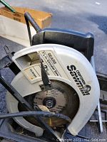 Close up of Craftsman 7-inch circular saw blade and guard with brand and blade size visible