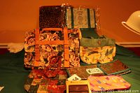 Full lot showing floral cloth satchel with leather straps, three totes including insulated tote, and smaller pouches
