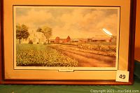 Frontal image of the signed limited edition print titled 'A Silence's Rest' showing the rural farm scene with house and barns, matted and in a wooden frame with gold trim.