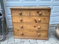 Full front view of the antique pine 5 drawer dresser showing drawer layout and wood finish.