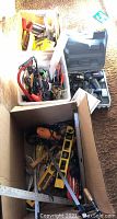 Three boxes of assorted tools including hand tools and a Ryobi drill in its case with accessories and manual.