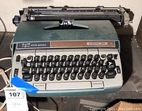 Front view of vintage Smith-Corona Electra 220 typewriter showing full keyboard, woodgrain trim, and manufacturer labels.