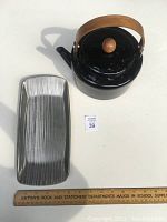 Photo showing black enamel kettle with wooden handle and knob, alongside the silver brushed metal tray with linear texture; includes measuring ruler for scale.