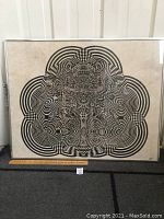 Full view of the framed Op Art print showing the entire artwork and frame along with a ruler for scale.