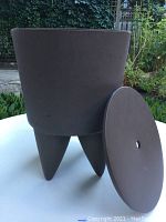 Photo of the brownish/taupe Philippe Starck 1er Bubu stool without the lid, showing the shape and color.