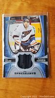 Front of 2005-06 NHL Power Play Olaf Kolzig Jersey Card showing player image, embedded jersey fabric, and Washington Capitals branding.