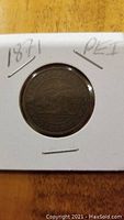 Front side of 1871 Prince Edward Island one cent coin showing sailing ship and date.
