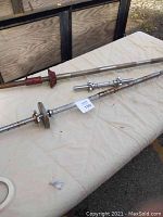 Three barbells on a table showing condition variations.