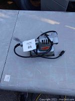 Top and side angles of the Black & Decker finishing sander showing overall shape, condition and labels.