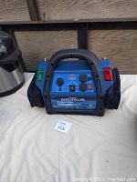 Front view showing digital display, control panel and vents