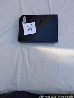 Top view of black Nintendo Wii console with MaxSold lot number sticker attached.