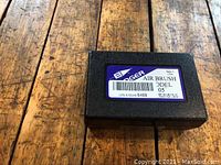 Closed black plastic case with label indicating Badger Air Brush Model 05
