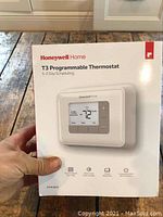 Front view of the Honeywell Home T3 Programmable Thermostat box showing product image and branding.