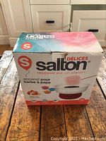 Boxed Salton cotton candy maker from front showing brand and product image.