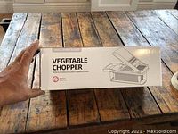 Front side of the vegetable chopper box showing product name, image and basic details