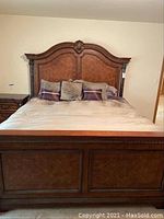 Full front view of Bedframe showing headboard, footboard, inlaid panels and marble columns