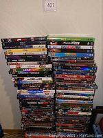 Stacked DVDs showing titles like '21 Jump Street', '2012', 'Where the Wild Things Are', 'The Help', 'Erin Brockovich', 'The Princess and the Frog', among others
