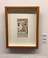 Frontal view of the framed mixed media artwork showing the full wood shadow box frame and white matting around the central piece titled 'Measurement'.