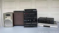 Photo of York Newave stereo system, speakers, Toshiba DVD player, and video cassette player.