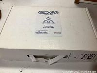 Sealed white outer box with Geomag logo and product name 'Wooden Box Collection 750'.