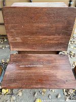 Top view of the antique wooden school desk showing worn wood grain and hinged top