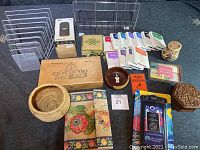 Full view of lot including file holders, speaker box, ink pads, wooden bowls, cigar box, beaded journal, and decorative items