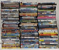 Photo of stacked DVD cases showing a range of youth and family movies including Disney titles, superhero movies, and others