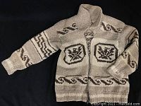 Full view of the Cowichan sweater showing front design and zipper