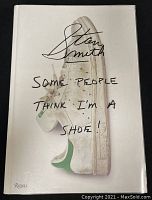 Front cover of the hardcover book featuring an image of a worn Adidas Stan Smith sneaker with text overlay.