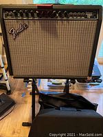 Front view of amplifier on stand with covers below